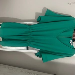 Size Small. New without tags, never worn. Belted romper with pockets!